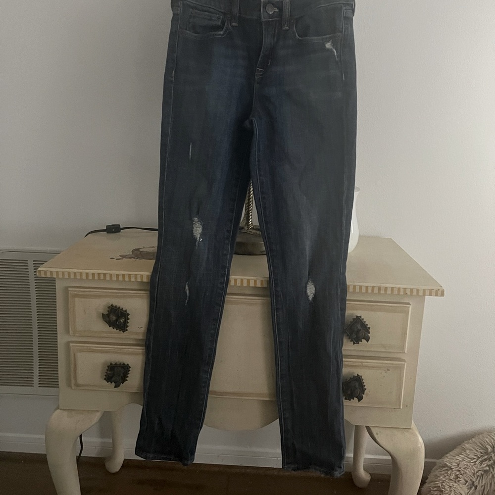 J. Crew ripped jeans.